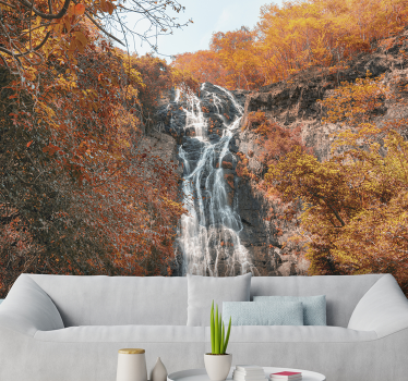 This beautiful phot wallpaper shows a waterfall in a forest in autumn The lovely and rich colors of orange and blue will look fantastic on your walls!